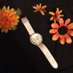 White and gold guess watch needs battery